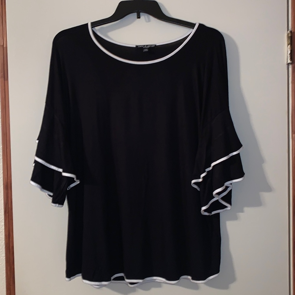 Black and white 1X Cable and Gauge blouse with bell sleeves